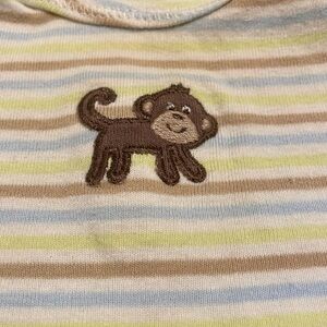 Cute striped onesie with monkey on the front